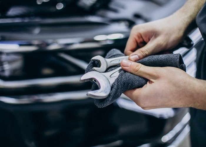 repair-man-making-car-service_1303-26870 24 hour tire service in Caldwell-tx